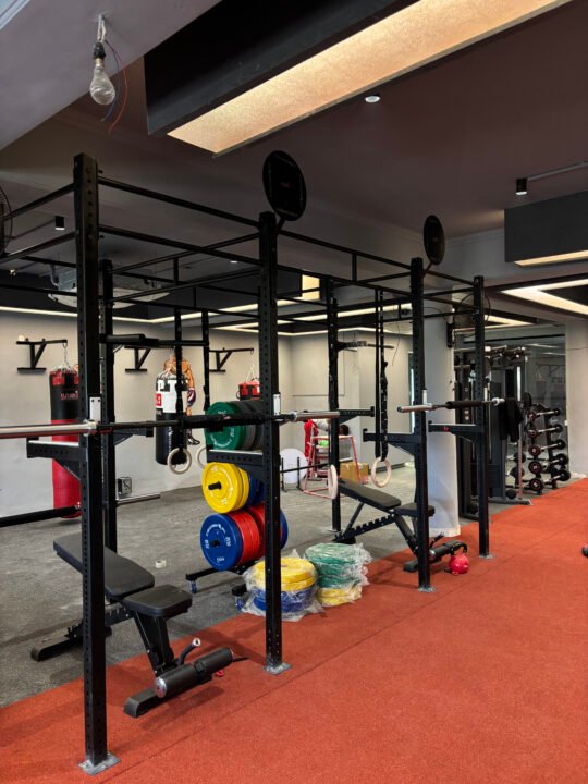 Squat rigs and bumper plates for strength training at BTF