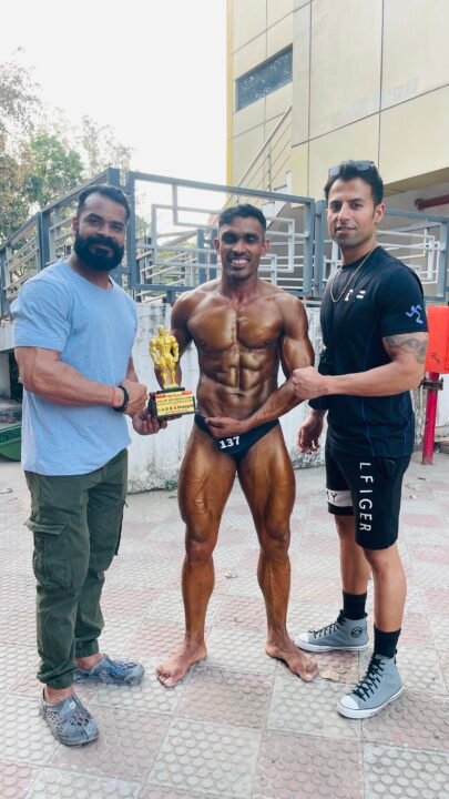 BTF New Chandigarh member winning a physique trophy with BTF coaches